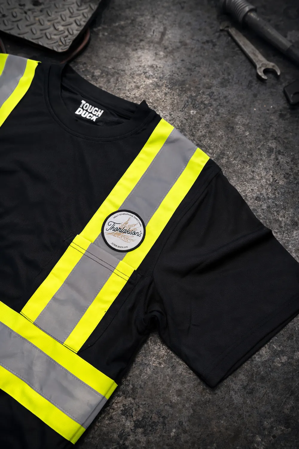 Work shirt with hi-vis stripes and a custom patch