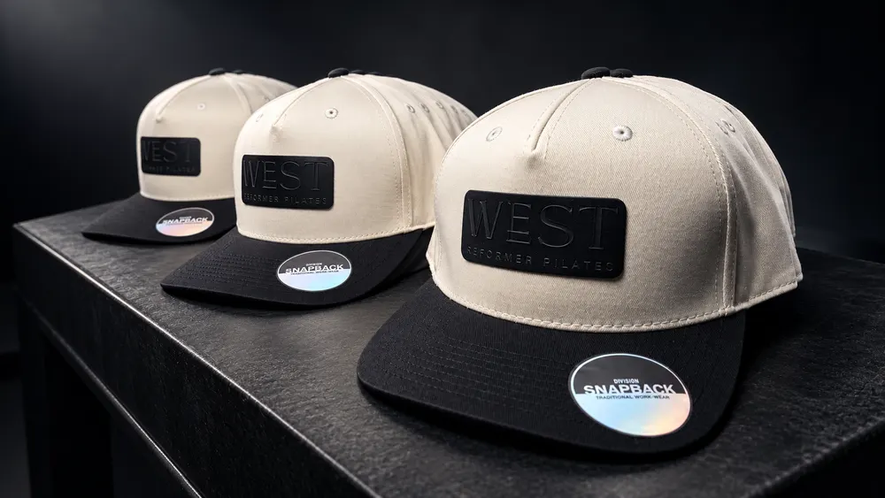 West Reformer Pilates branded hats